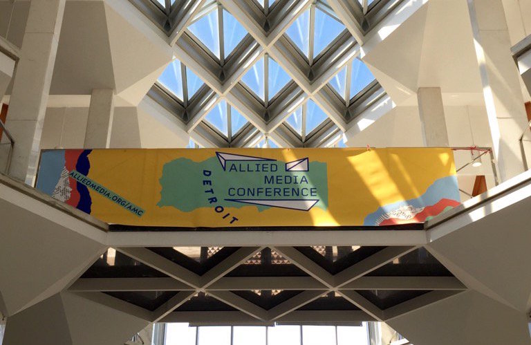 Inside the main hall at the AMC, a banner on the balcony with the words Allied Media Conference Detroit