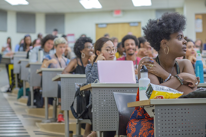 Attendees of the AMC in a classroom style setting