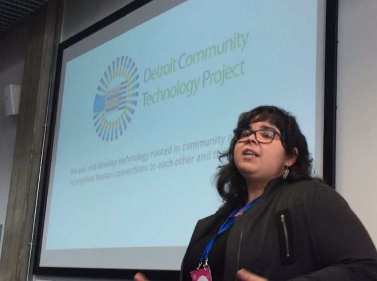 Diana Nucera in front of a projector giving a presentation