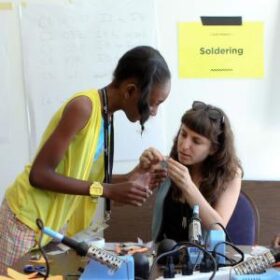 two people working on a tech project at a community discotech