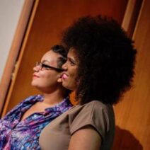 Two Black women on stage, presenting as Octavia's Brood