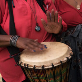 Person playing a hand drum