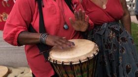 Person playing a hand drum