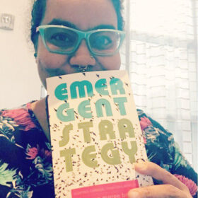 adrienne marie brown holding emergent strategy book